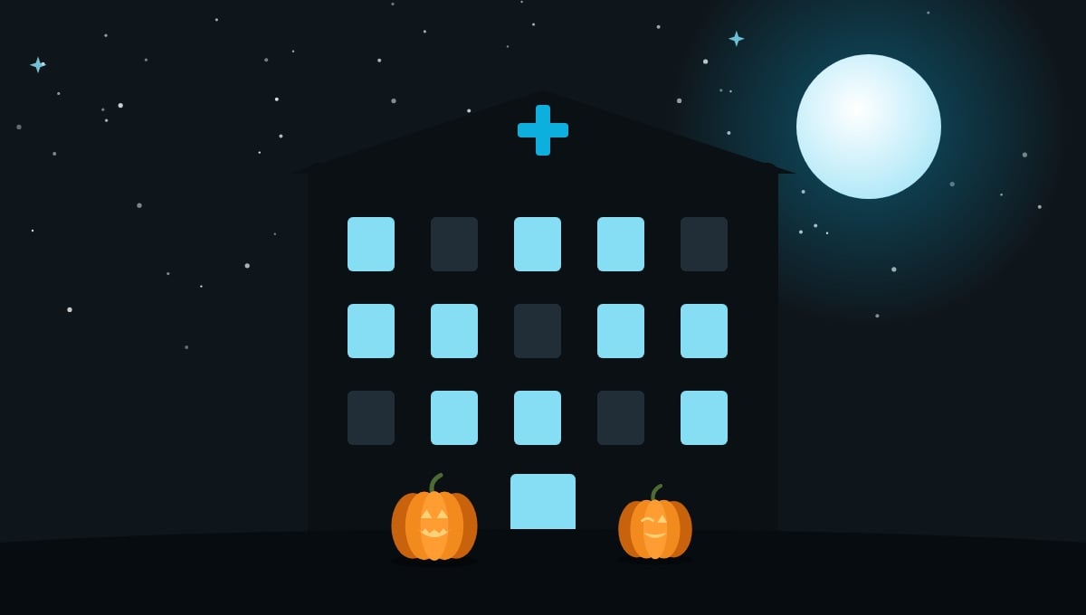 hero-h-dpm-clinic Clinic building at night with pumpkins at the front door